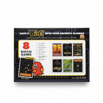 Bandai Namco white HDMI dongle retro game console with orange accents and Pac-Man keychain.